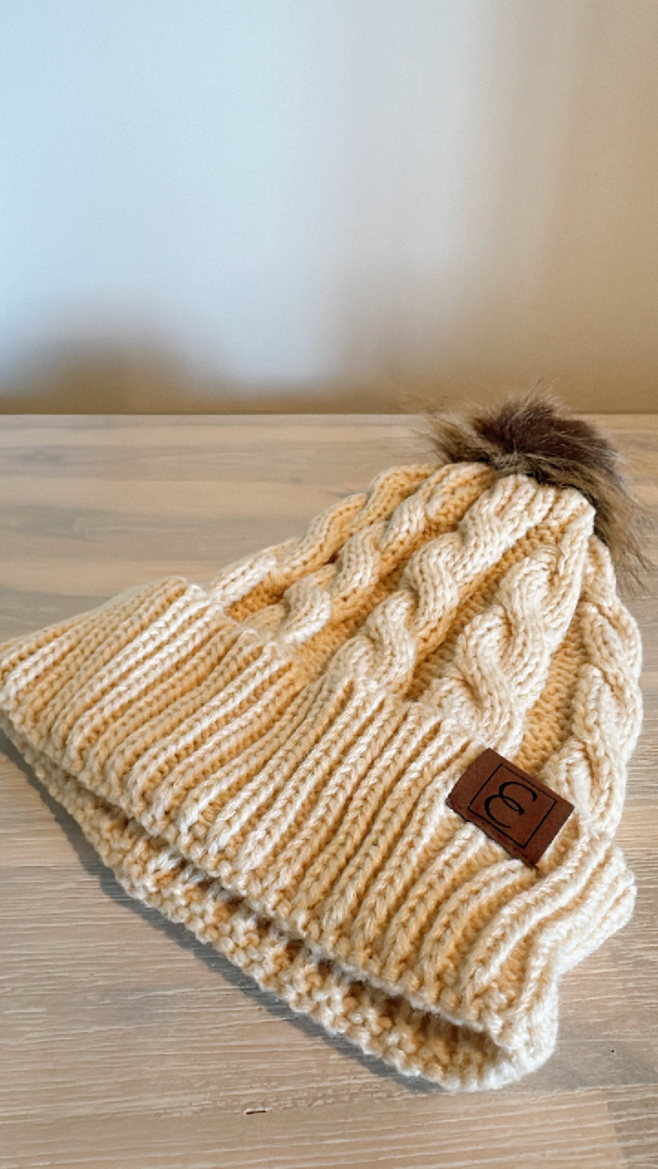 Beige pom pom beanie