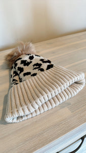 White leopard print pom pom beanie