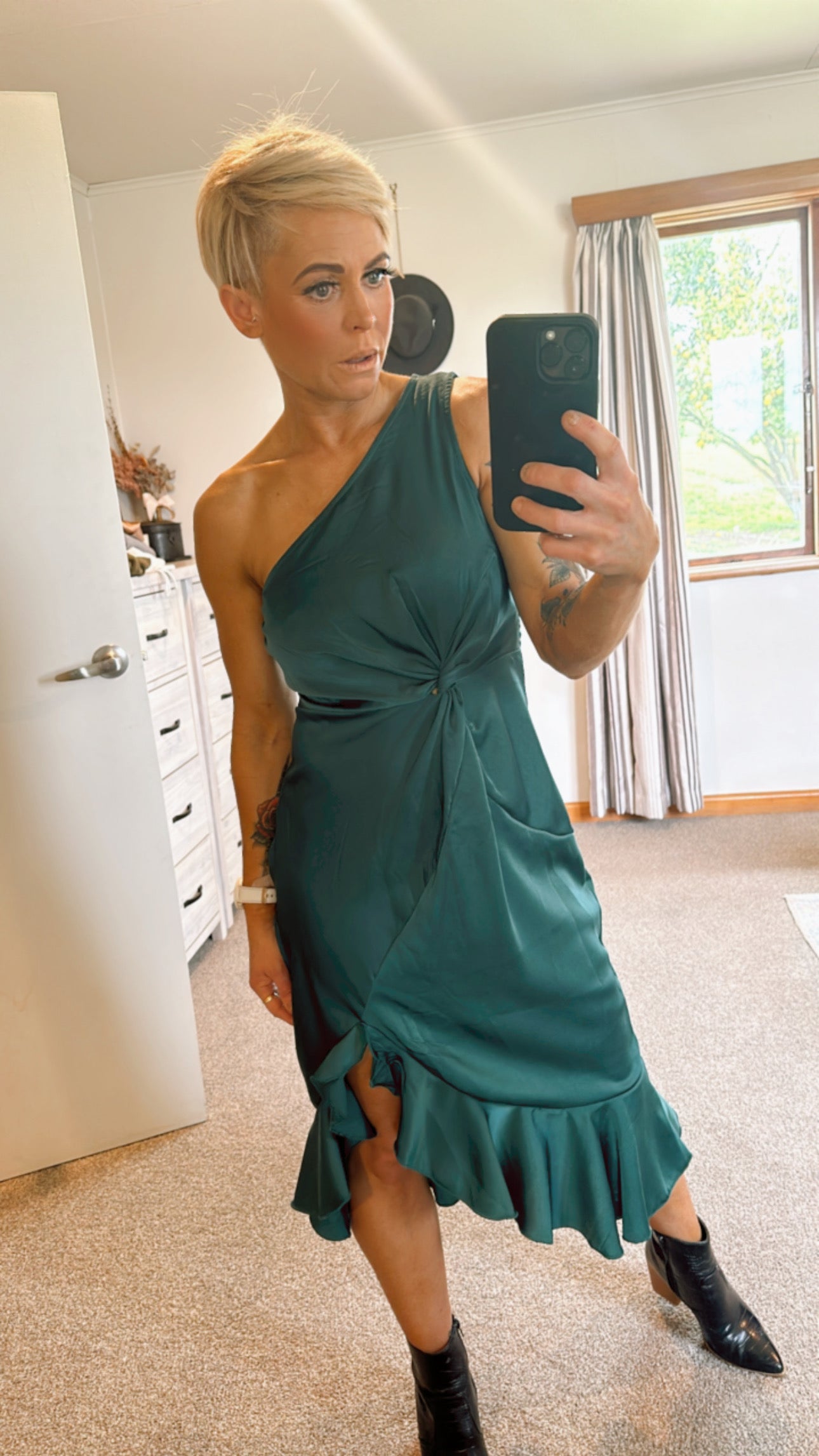 Emerald green ruffle hem twist detail one shoulder dress