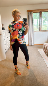 Bold coloured floral print tie neck batwing sleeve top