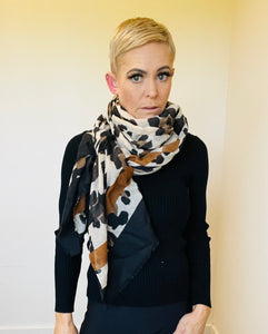 Leopard with stripe scarf