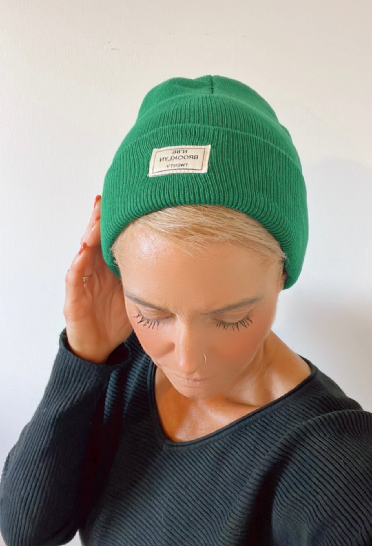 Green beanie with a patch