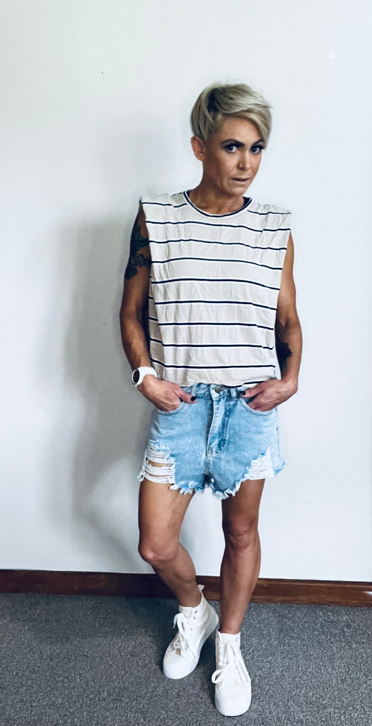 Raw edge distressed denim shorts